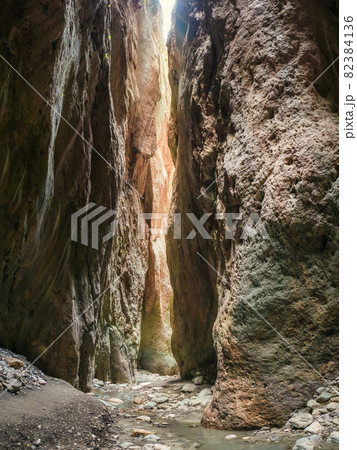 Sunlight in a mountain gorge. Karadakh gorge with sunlight in Dagestan. Vertical panorama. 82384136