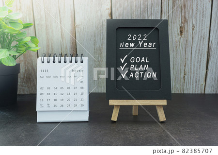 January 2022 white calendar with text on black notepad January 2022 white calendar with text on black notepad 82385707