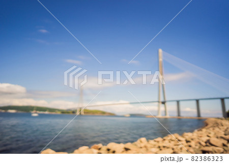 Blurred image. Cable-stayed bridge to Russian Island. Vladivostok. Russia. Vladivostok is the largest port on Russia's Pacific coast and the center of APEC Forum Blurred image. Cable-stayed bridge to Russian Island. Vladivostok. Russia. Vladivostok is the largest port on Russia's Pacific coast and the center of APEC Forum 82386323