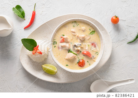 Spicy coconut Tom Kha Gai soup with chicken, cherry tomato. Asian Thai food. 82386421