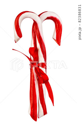 Two candy canes isolated on white background Two candy canes isolated on white background 82386831