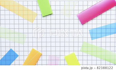 Multicolored stickers on the blank checkered page. Education concept. 82388122