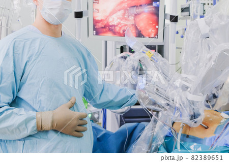 The process of carrying out a surgical operation using a modern robotic surgical system. Medical robot. The process of carrying out a surgical operation using a modern robotic surgical system. Medical robot. 82389651
