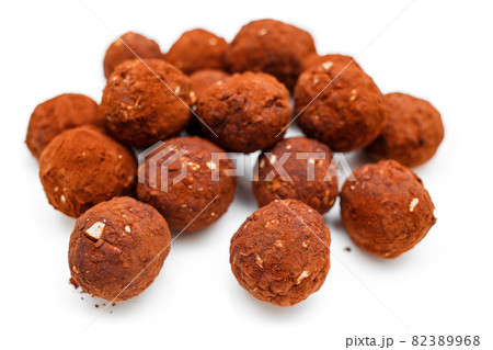 Chocolate homemade candy truffles isolated on white background. Homemade cooking background Chocolate homemade candy truffles isolated on white background. Homemade cooking background 82389968