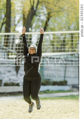 Afro-american plus size woman doing workout exercises session outdoor Afro-american plus size woman doing workout exercises session outdoor 82395261