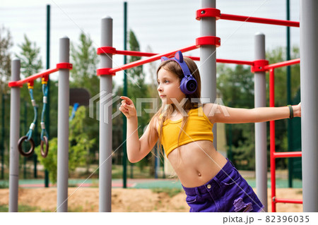Schoolgirl preteen workout on sports ground Schoolgirl preteen workout on sports ground 82396035