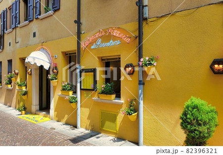 old houses on a street in riva del garda old houses on a street in riva del garda 82396321