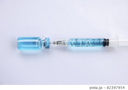 Close-up vials with vaccine and syringe for virus protection isolated on white background. Horizontal composition. 82397954