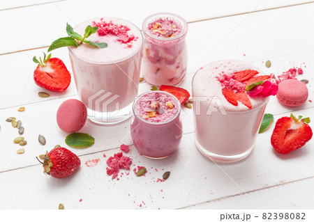Strawberry with yogurt on white rustic wooden background. Cream dessert Strawberry with yogurt on white rustic wooden background. Cream dessert 82398082