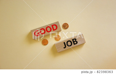 Good job symbol. Concept words 'good job' on wooden blocks on a beautiful white background, metallic coins. Business and good job concept, copy space. 82398363