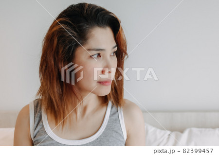 Attractive woman relax after wake up in bedroom. Summer vacation. Attractive woman relax after wake up in bedroom. Summer vacation. 82399457