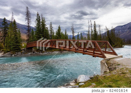 Bridge over the Glacier River in Canadian Rocky Mountain Landscape. 82401614
