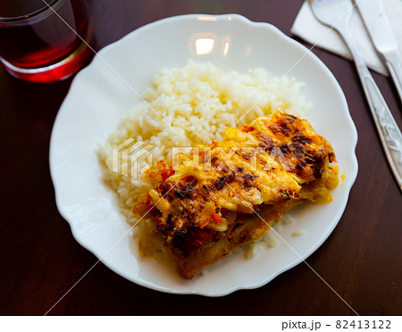 Chicken fillet with mushrooms and boiled rice on table Chicken fillet with mushrooms and boiled rice on table 82413122
