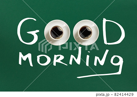 Close-up top view of cup of fresh hot coffee and good morning inscription 82414429