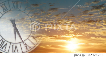 Double exposure of clock face in sunset sky. Time passing concept. 82421290