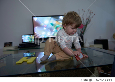 cute little one year old baby and making first steps cute little one year old baby and making first steps 82423344