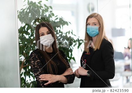 business team in protective medical mask at modern office 82423590