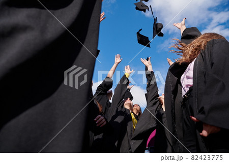 Group of diverse international graduating students celebrating Group of diverse international graduating students celebrating 82423775
