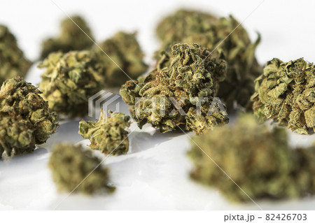 Marijuana pieces on isolated white background 82426703