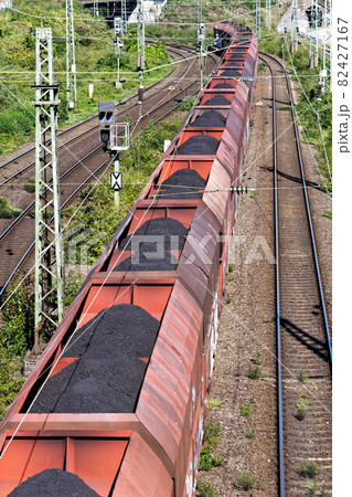 coal train passes under a bridge coal train passes under a bridge 82427167