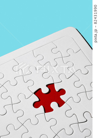 red gap in a blank white jigsaw puzzle 82431990