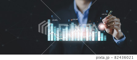 Businessman use pen touch line graph of business stock market concept, analytics and financial, Changes in new planning, Business growth, ideas and perspectives, Stock investment, and dividends 82436021