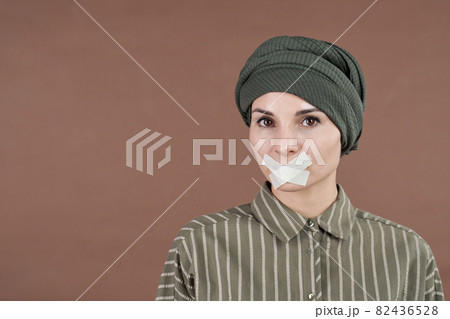 Woman With Tape On Mouth 82436528