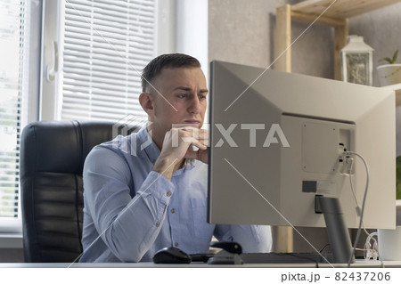 Pensive young man is thinking about a project.Office worker ponders the solution to problem. Boss solves business issues Pensive young man is thinking about a project.Office worker ponders the solution to problem. Boss solves business issues 82437206
