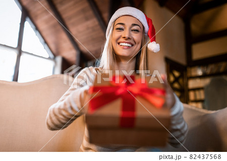 Happy Woman Giving Present To Laptop Webcam At Home 82437568