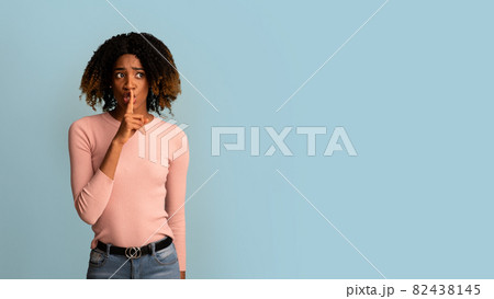 Keep Silence. Worry Black Woman Holding Finger Near Lips And Looking Away 82438145