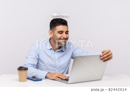 Emotional man sitting and working on office Emotional man sitting and working on office 82442014