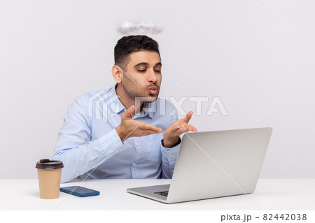 Emotional man sitting and working on office Emotional man sitting and working on office 82442038