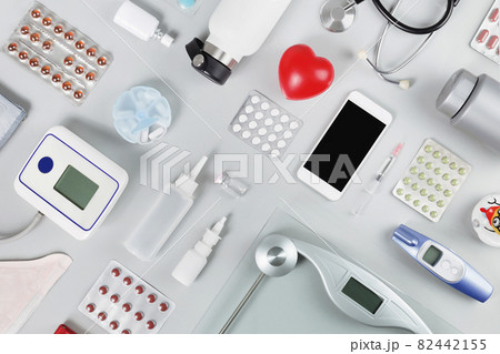 Red heart with phonendoscope scale tablets. Medical flat lay Red heart with phonendoscope scale tablets. Medical flat lay 82442155