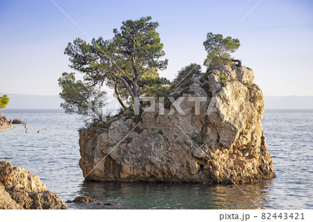 Small stone islet on Punta Rata beach in Brela Small stone islet on Punta Rata beach in Brela 82443421