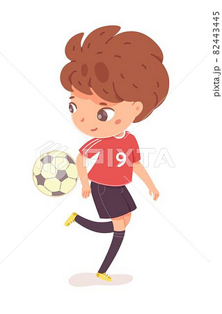 Boy kicking ball by leg at football practice. Happy little kid playing sport in uniform vector illustration. Smiling child kicking ball near floor by foot on white background 82443445