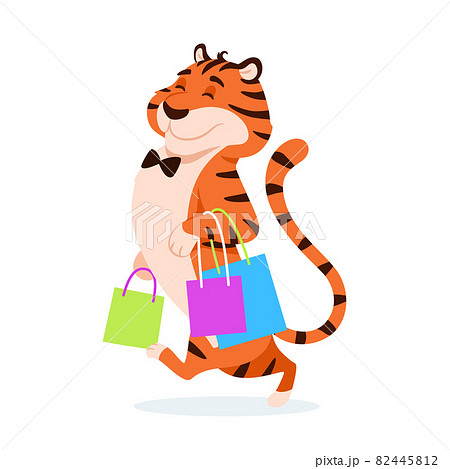 Cartoon happy tiger with shopping bags isolated on white background. Adorable cute wild cat with present. Big sale, holiday discount design. Advertising beautiful animal character vector illustration. 82445812