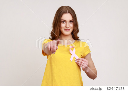 Portrait of young emotional woman on gray background. Portrait of young emotional woman on gray background. 82447123