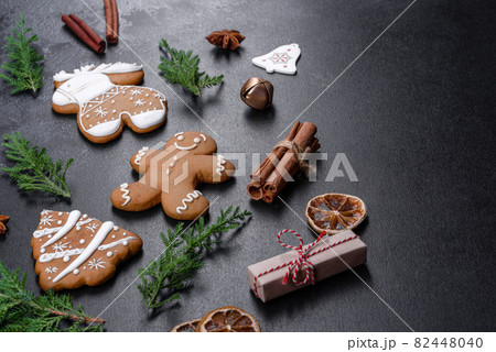 Christmas festive gingerbread made at home on a dark table Christmas festive gingerbread made at home on a dark table 82448040