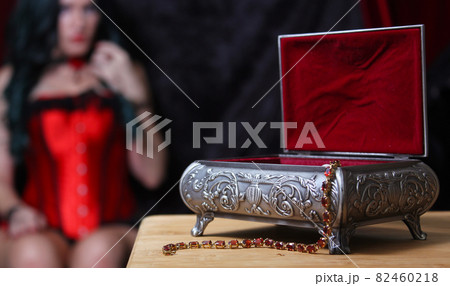 Jewelry Box with Woman in Corset in background, Shallow DOF, Focus on Jewelry Box Jewelry Box with Woman in Corset in background, Shallow DOF, Focus on Jewelry Box 82460218