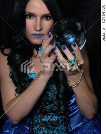 Woman in Blue Corset With Crystal Ball 82464020