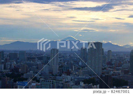 View of Mt. Fuji as seen from central Tokyo Japan showing the city with the sun setting behind Fuji-san View of Mt. Fuji as seen from central Tokyo Japan showing the city with the sun setting behind Fuji-san 82467001