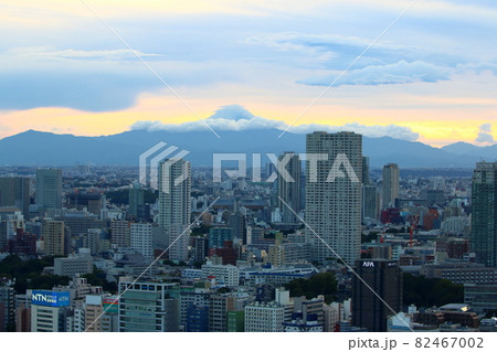 View of Mt. Fuji as seen from central Tokyo Japan showing the city with the sun setting behind Fuji-san View of Mt. Fuji as seen from central Tokyo Japan showing the city with the sun setting behind Fuji-san 82467002