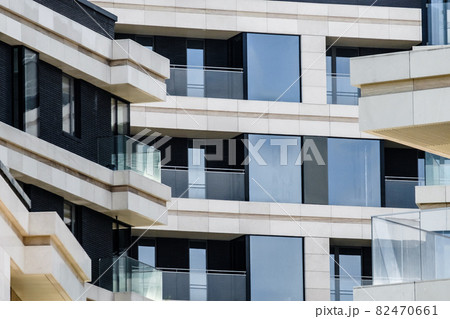 Facade elements of a modern beautiful building in a European city with balconies 82470661