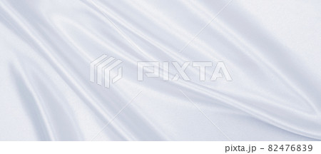 Smooth elegant grey silk or satin luxury cloth as wedding background. Luxurious background design Smooth elegant grey silk or satin luxury cloth as wedding background. Luxurious background design 82476839