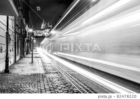 Night tram in Prague. Motion blurred tram in Letenska Street, Lesser Town of Prague, Czech Republic. Black and white image. 82478220