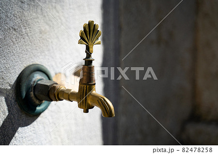 closeup of vintage bronze water faucet 82478258