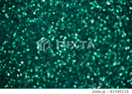 Green abstract background with bokeh. Sparkling glitter texture. Green abstract background with bokeh. Sparkling glitter texture. 82480218