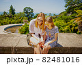 Happy family mother and her adorable little daughter on summer vacation taking selfie with smartphone 82481016