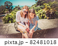 Happy family mother and her adorable little daughter on summer vacation taking selfie with smartphone 82481018