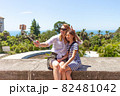 Happy family mother and her adorable little daughter on summer vacation taking selfie with smartphone 82481042